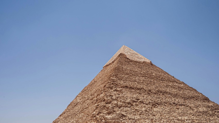 a pyramid with a blue sky