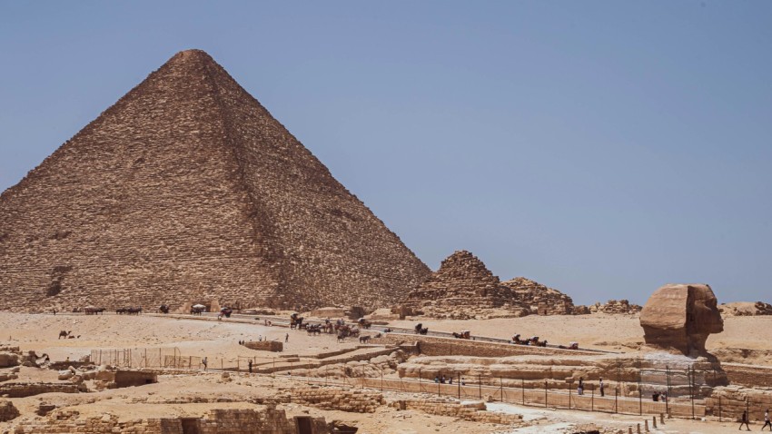 a group of pyramids in a desert