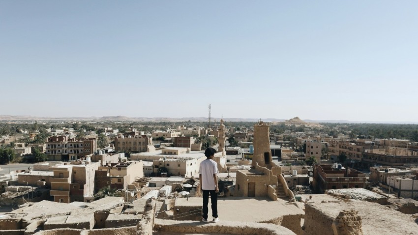 a man standing on top of a tall building