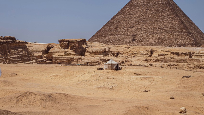 a group of pyramids in a desert