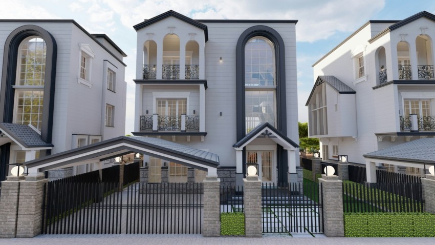 a three story house with arched windows and a gate