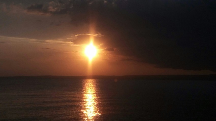 sun setting over the sea