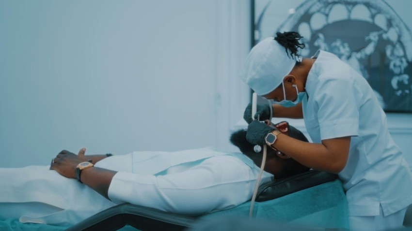 a person in a hospital bed with an oxygen tube