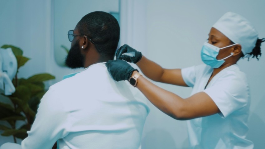 a woman getting her hair done by a man