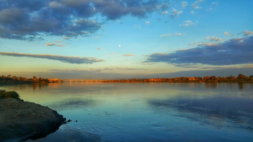 a body of water with a bridge in the background 5LzCTRV