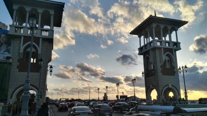 a bunch of cars that are sitting in the street waoGENoG