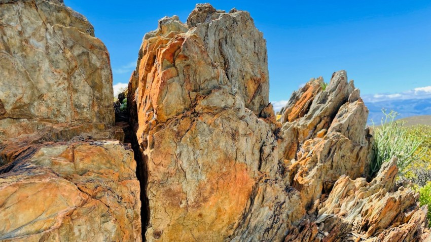 a large rock formation in the middle of a desert  Z