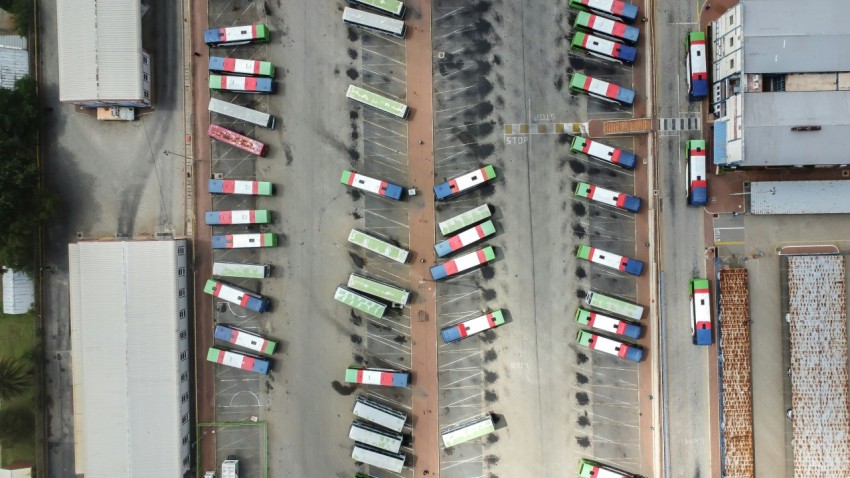 an aerial view of a parking lot filled with cars