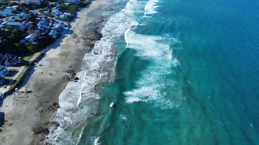 a birds eye view of a beach and ocean