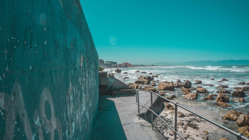 a view of the ocean from a concrete wall G