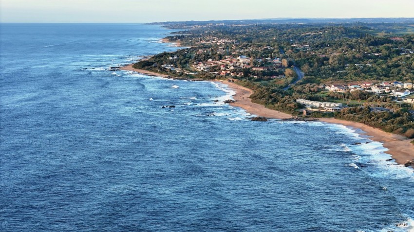 an aerial view of a beach and a city