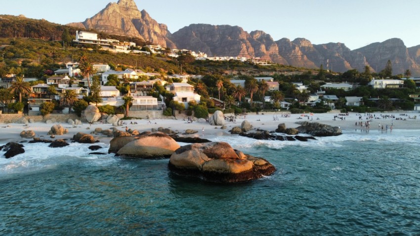 a view of a beach with mountains in the background