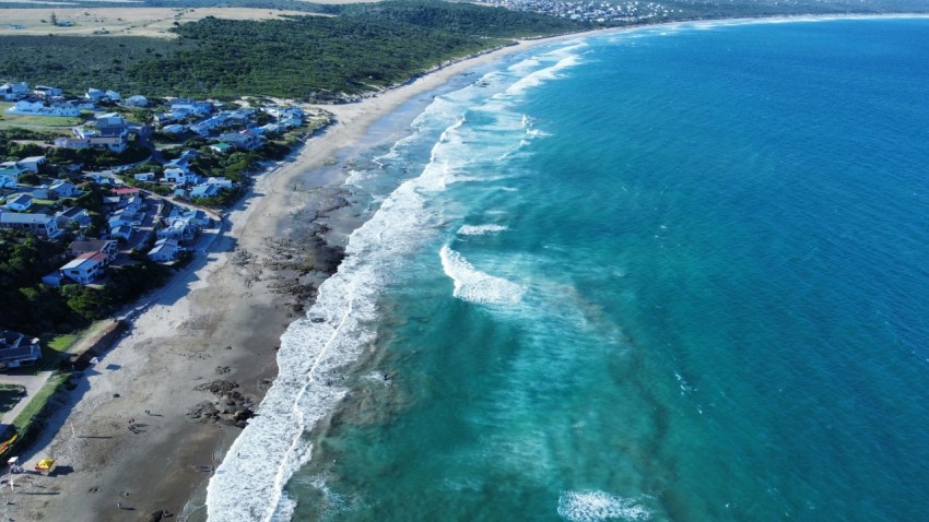 a birds eye view of a beach and ocean