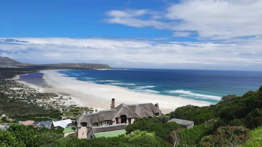 a house on a hill overlooking the ocean