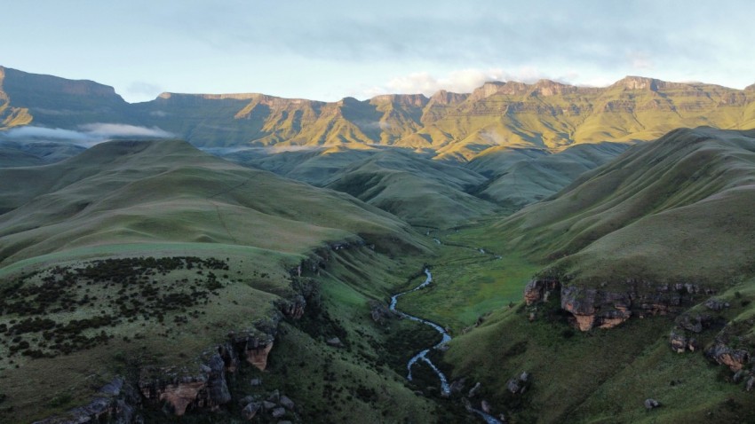 a mountain range with a river running through it