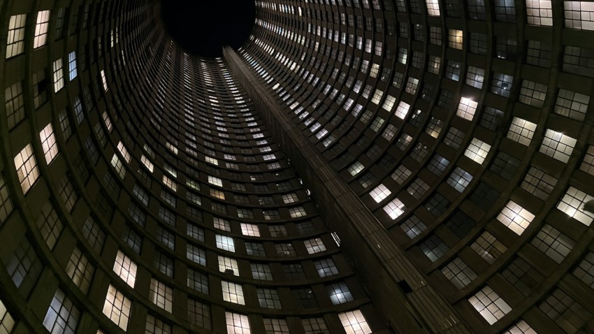 a large building with many windows with ponte city apartments in the background