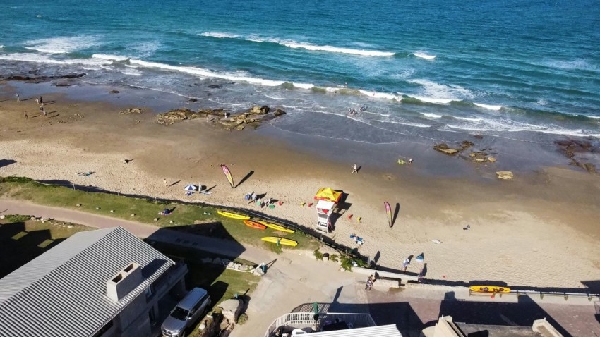 an aerial view of a beach with people on it