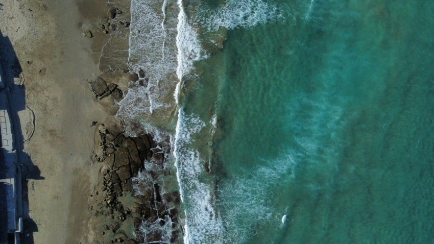 an aerial view of a beach and ocean