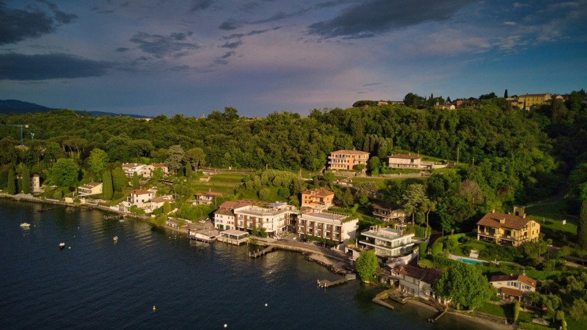 an aerial view of a small town on a lake