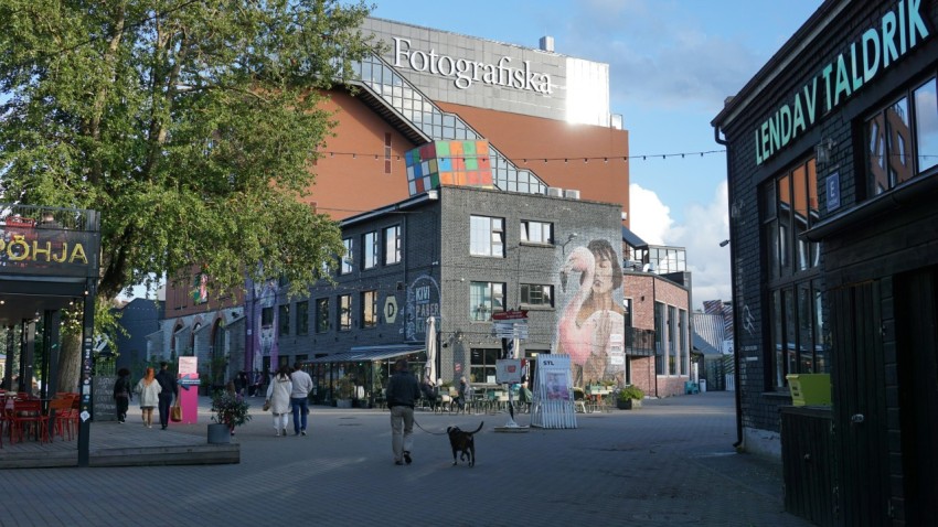 a city street with people walking down it