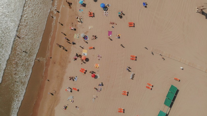 an aerial view of a beach with people on it