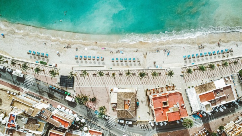 an aerial view of a beach and a city