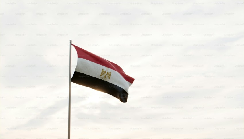 a flag flying in the wind on a cloudy day