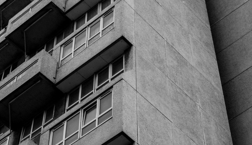 gray concrete building with glass windows