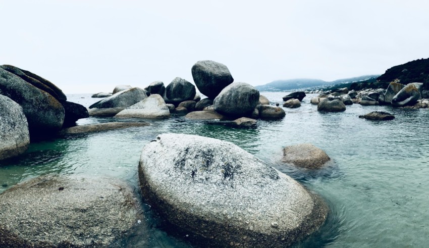 a body of water surrounded by large rocks