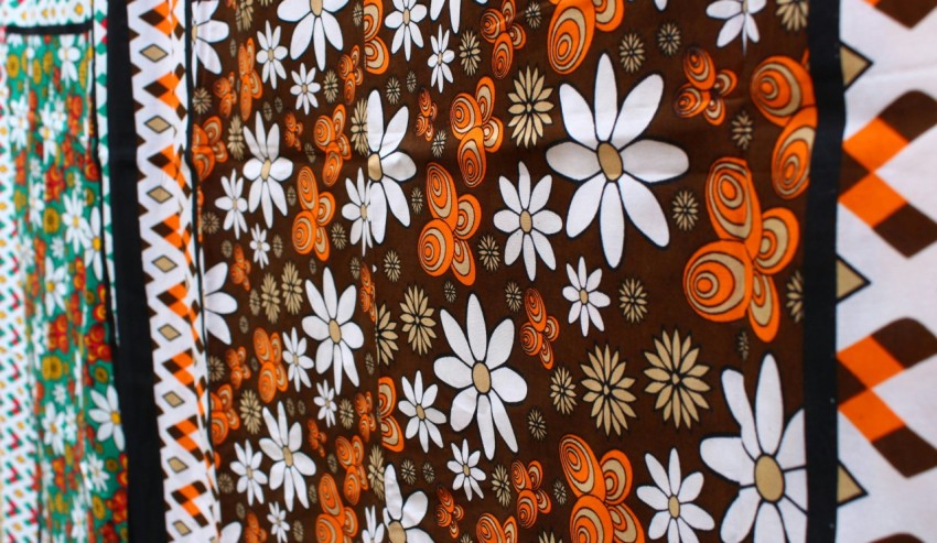 orange white and black floral textile