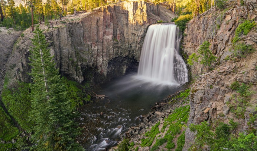 a waterfall with a waterfall in the middle of it