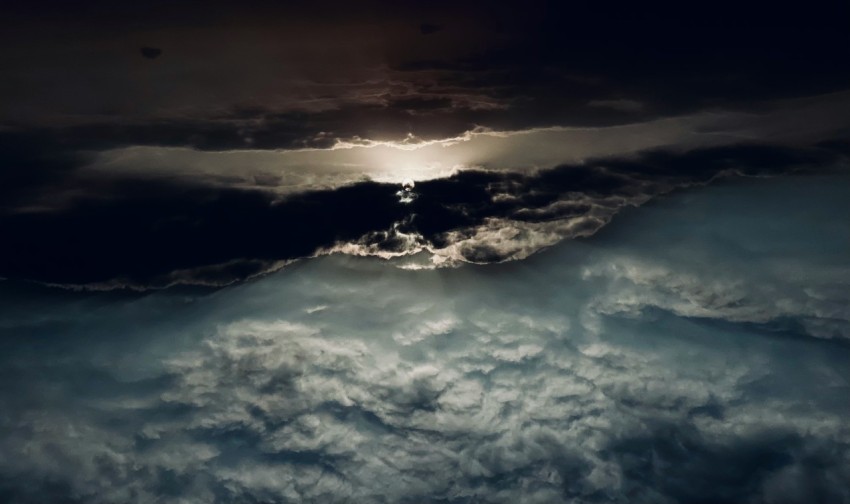 white clouds over mountains during daytime