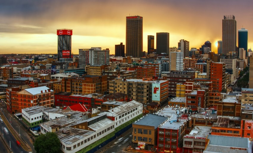 a view of a city with a train in the foreground _h