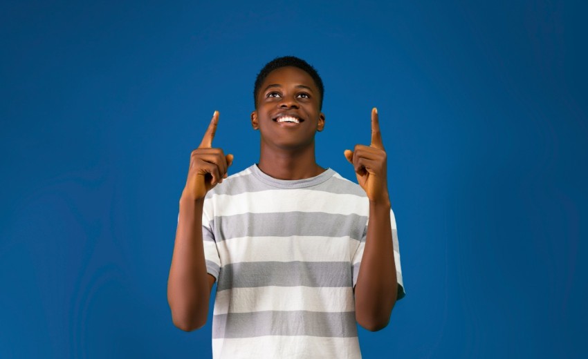 a boy holding up his hands