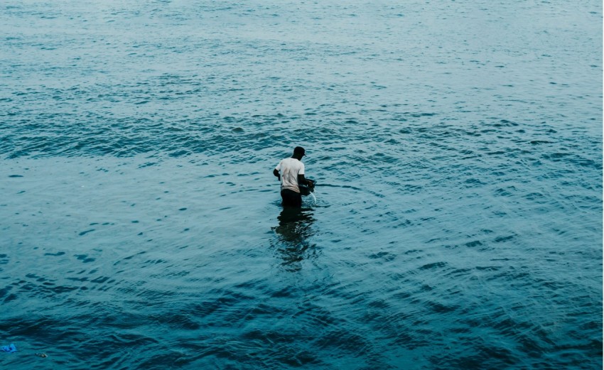 a person fishing in the water