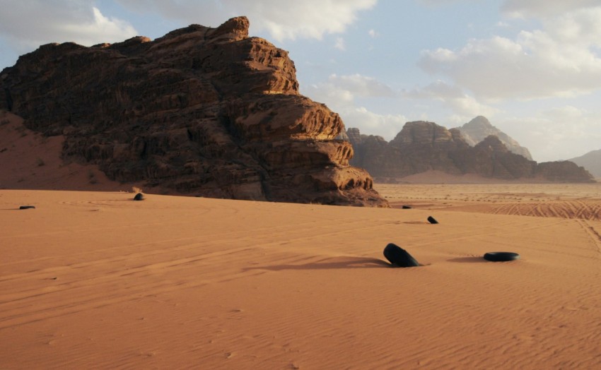 brown rock formation on brown sand during daytime