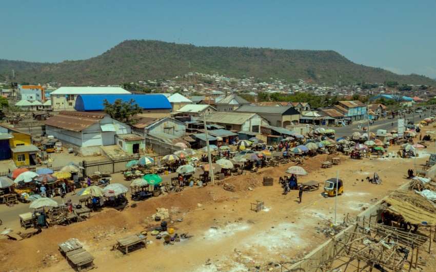 a group of people standing around a village