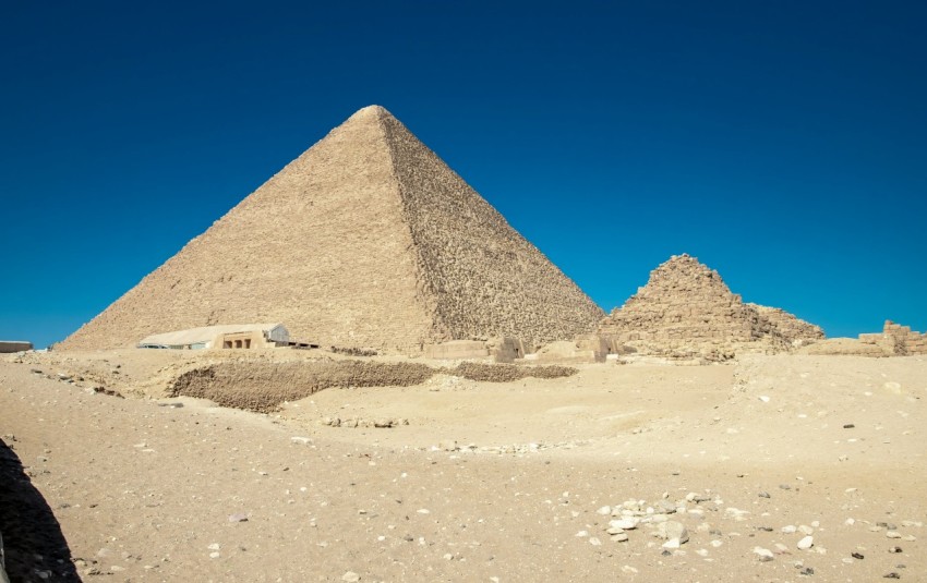 a group of pyramids in a desert