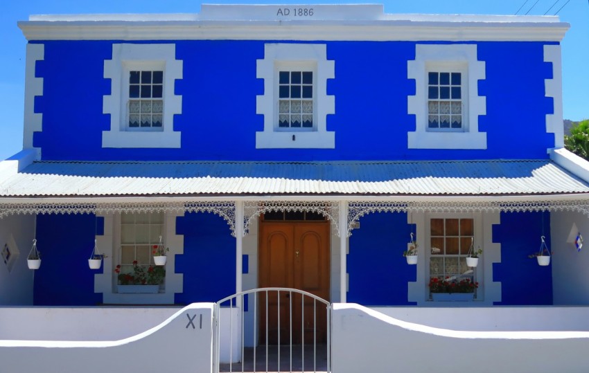 white and blue painted 2 storey house