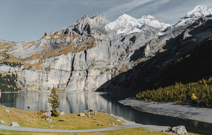 lake near snow covered mountain during daytime ZLuscixku