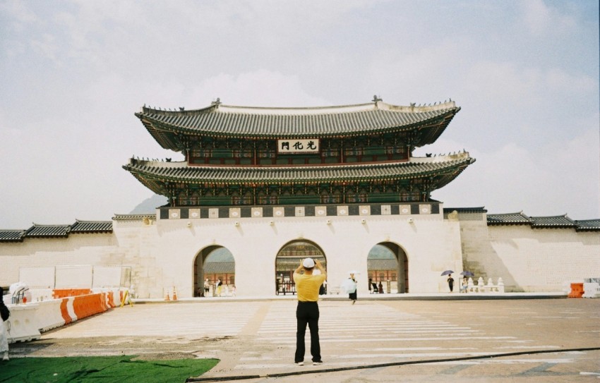 a person standing in front of gwanghwamun