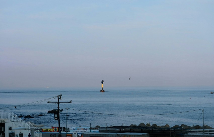 a view of the ocean from a rooftop of a building 7