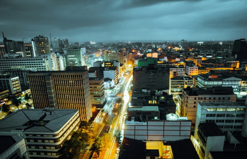 a view of a city at night from the top of a building