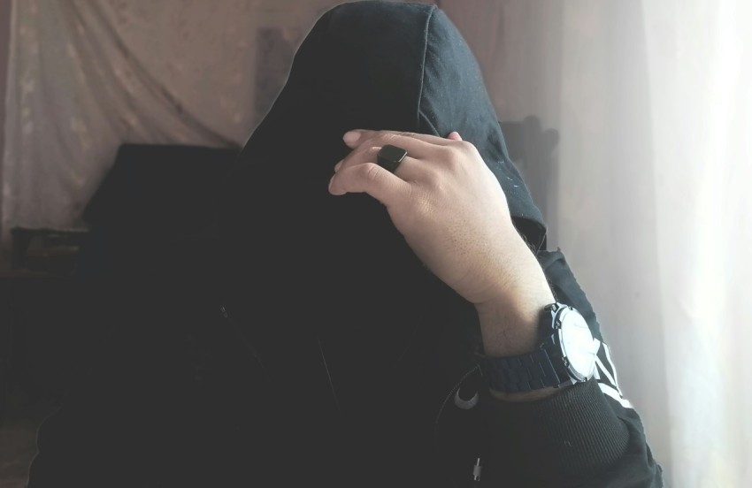 person in black hijab covering face