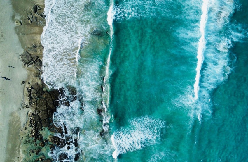 a birds eye view of a beach and ocean