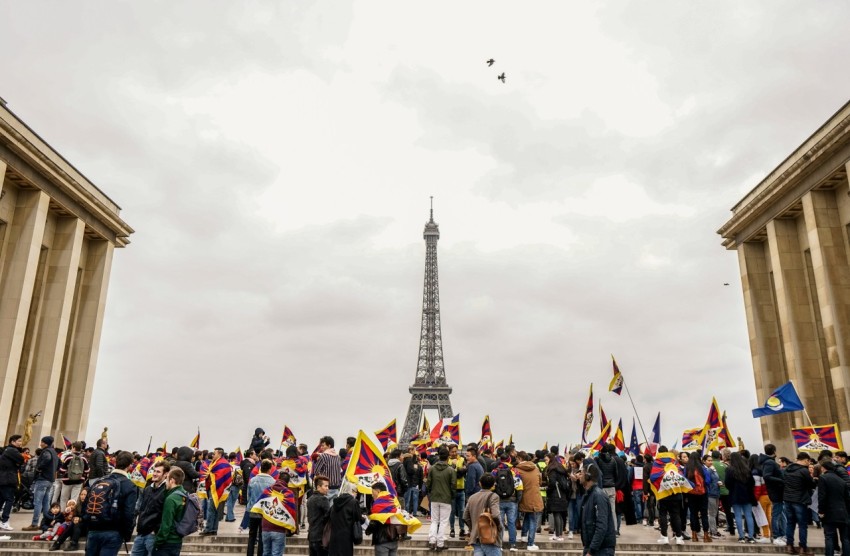 people gathering near eiffel tower of paris