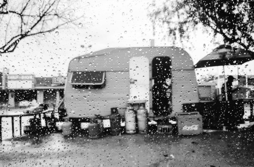 grayscale photo of truck on road