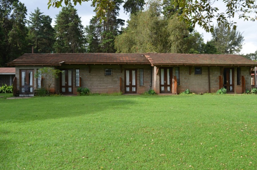 brown wooden house on green grass field