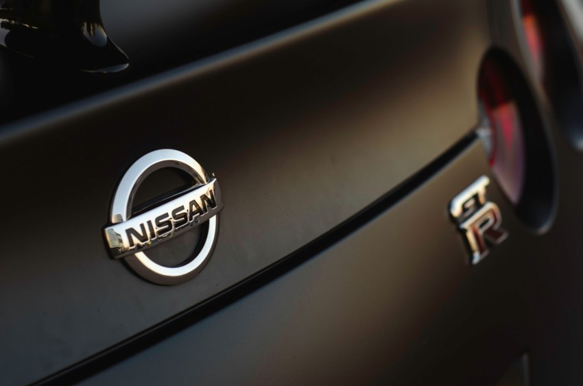 a close up of a nissan emblem on a car