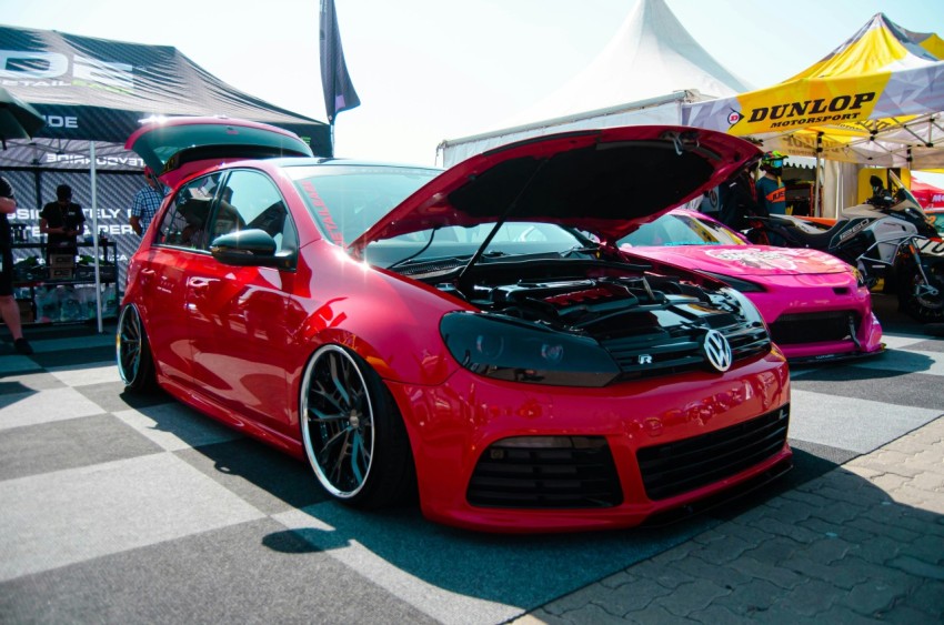 a red car with its hood open